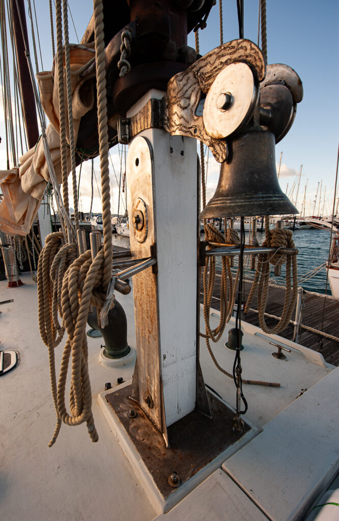 The bell was recovered from a shipwreck in 1993, the identity of which is unknown. It's now repurposed as the bell for Charles Dibdin. The bell bracket was creative metalwork by Mark House.
